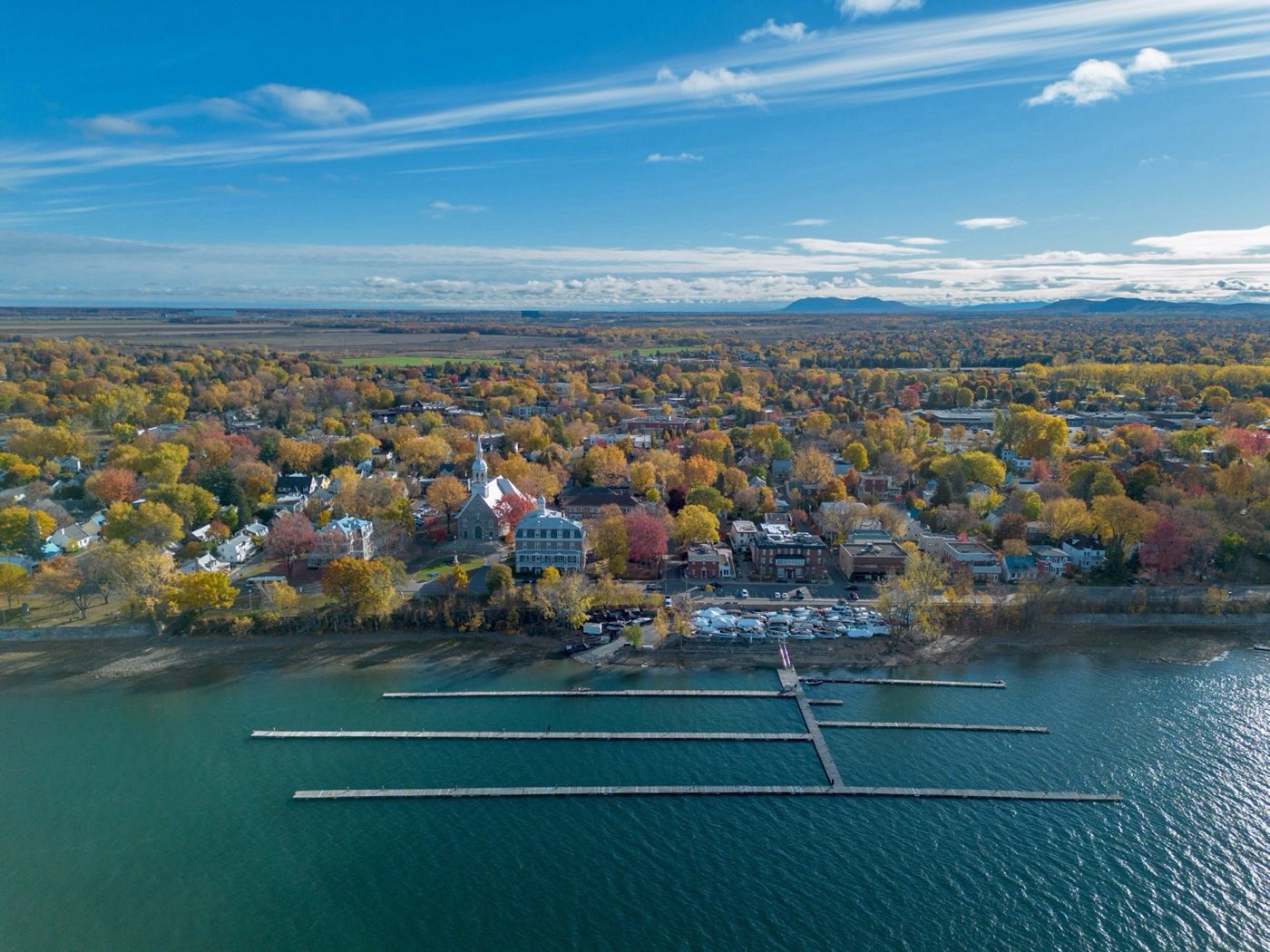Aerial view of Vieux-Boucherville, Église Sainte-Famille and the marina in autumn