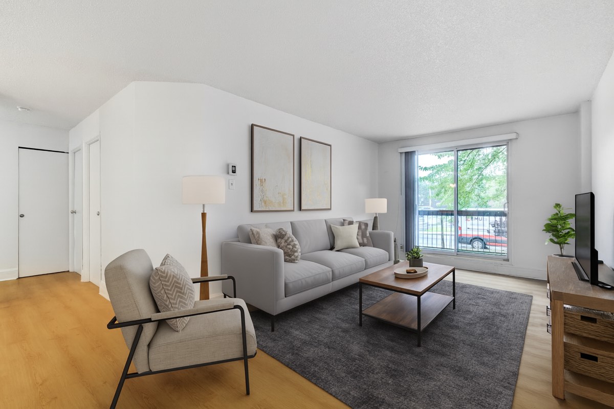 Staged living room with balcony window in the 4½