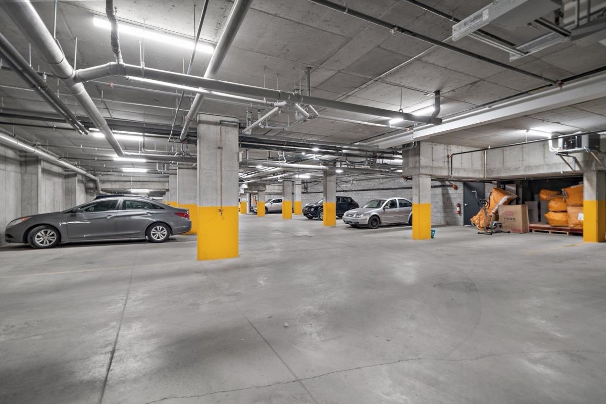 The indoor parking garage under the building