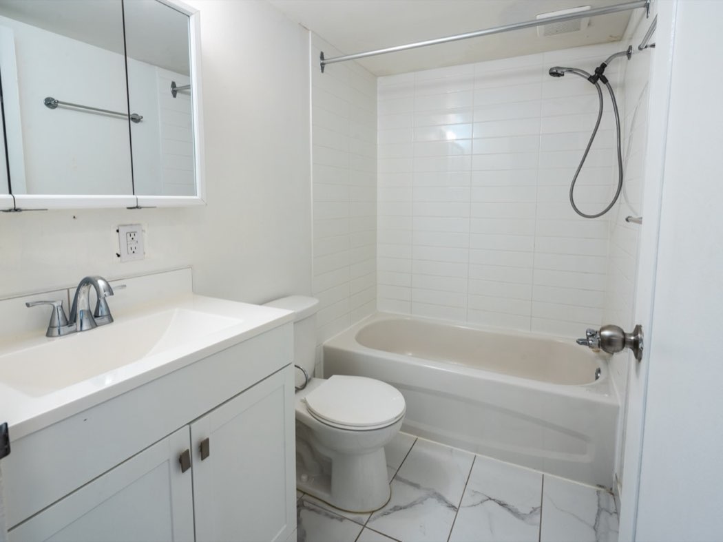 Bathroom with bath and vanity