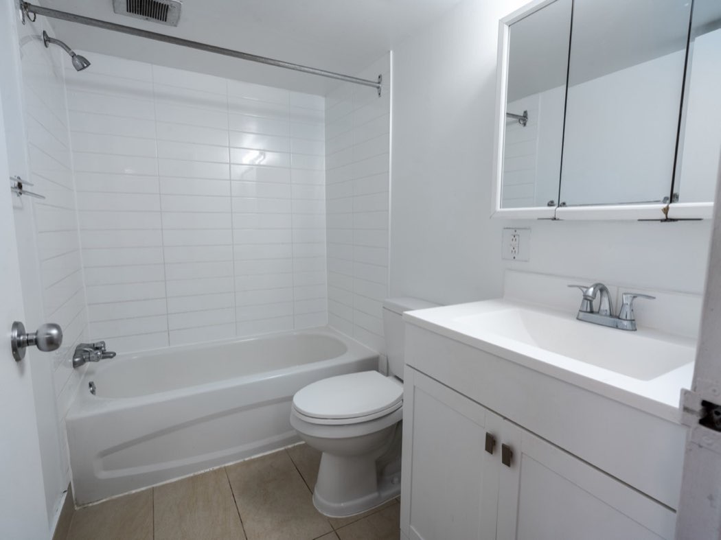 Bathroom with bath and vanity