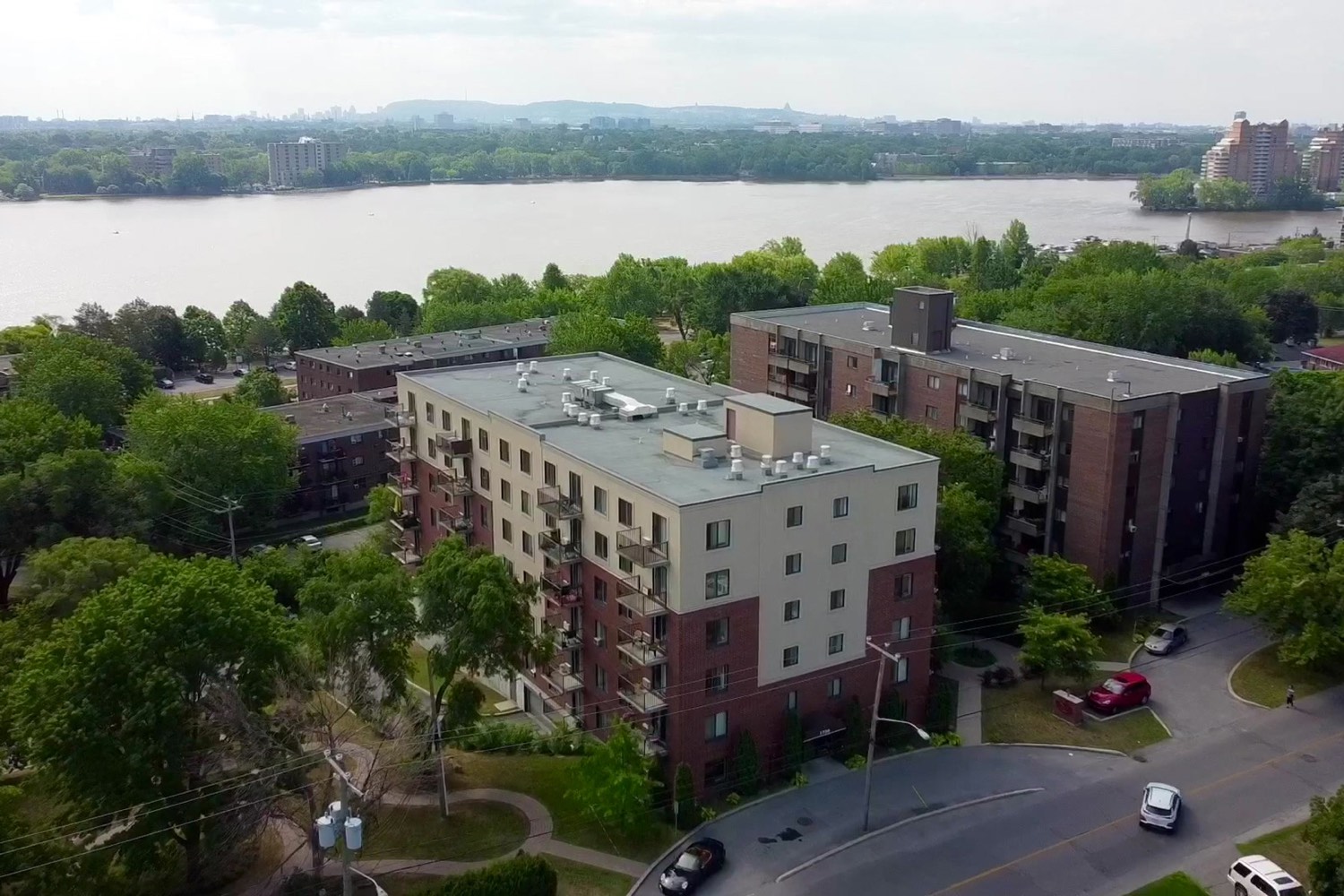 The building from the air, beside the river