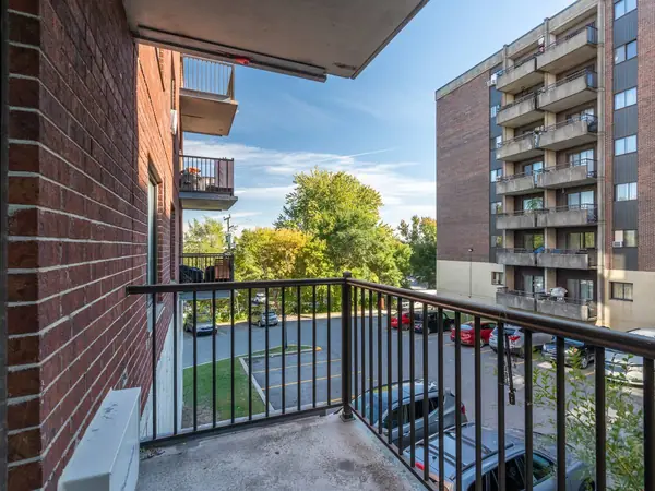The balcony looking over the parking and trees.