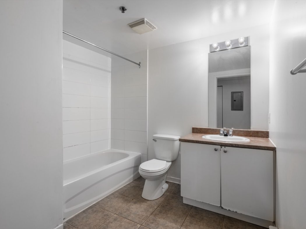 Bathroom with bath and vanity