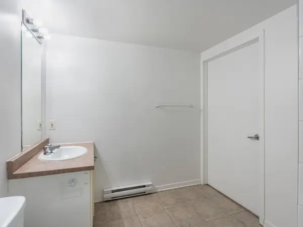 Bathroom vanity and door.