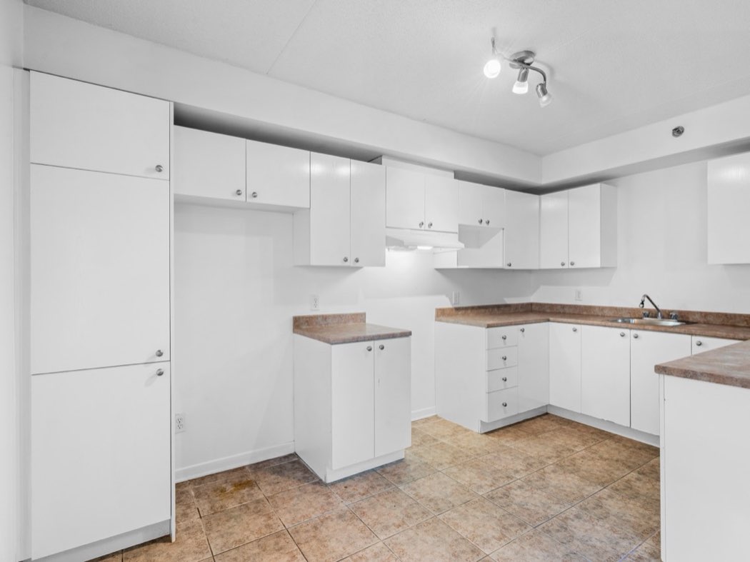 Kitchen with counter and cupboards