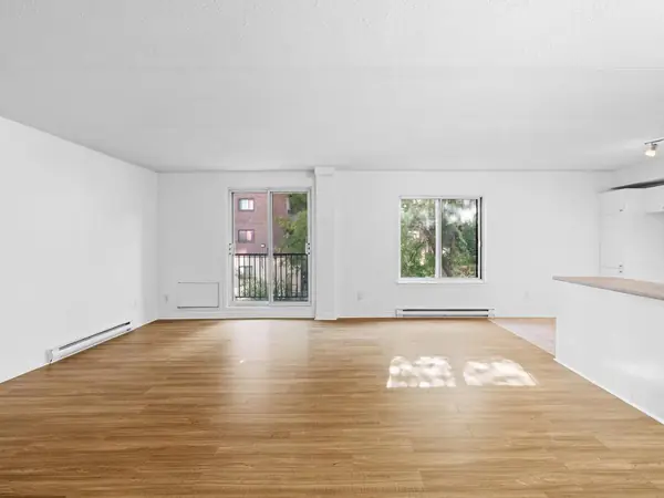 The main room with the balcony door and a window.