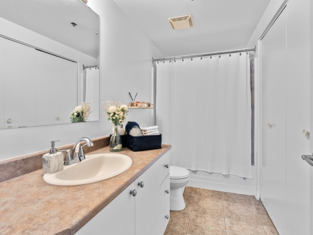Bathroom with bath and vanity