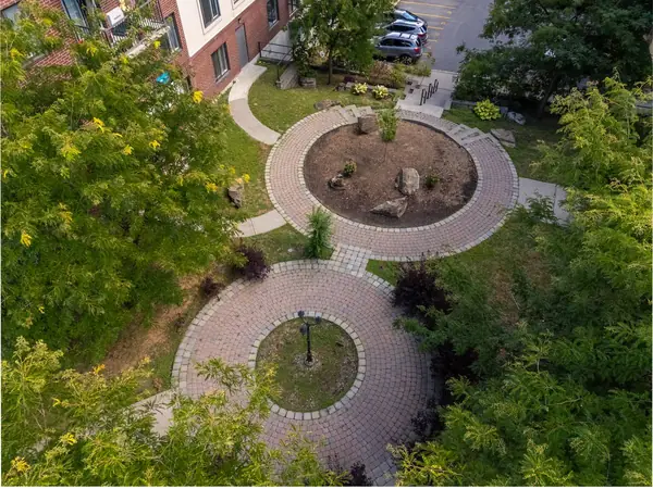The landscaped courtyard with paved circles, seen from above.