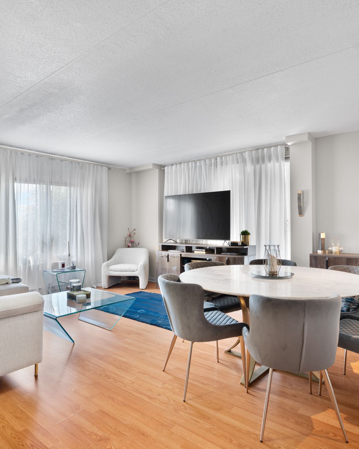 Staged living and dining area at 1750 boulevard Lévesque Est