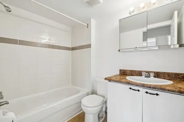 Bathroom with bath and vanity