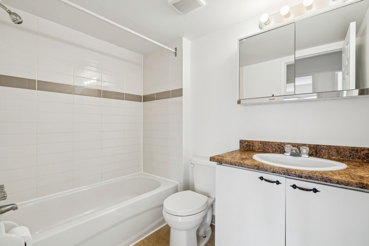 Bathroom with bath and vanity