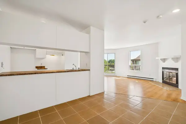 Kitchen counter open to the living room and its fireplace