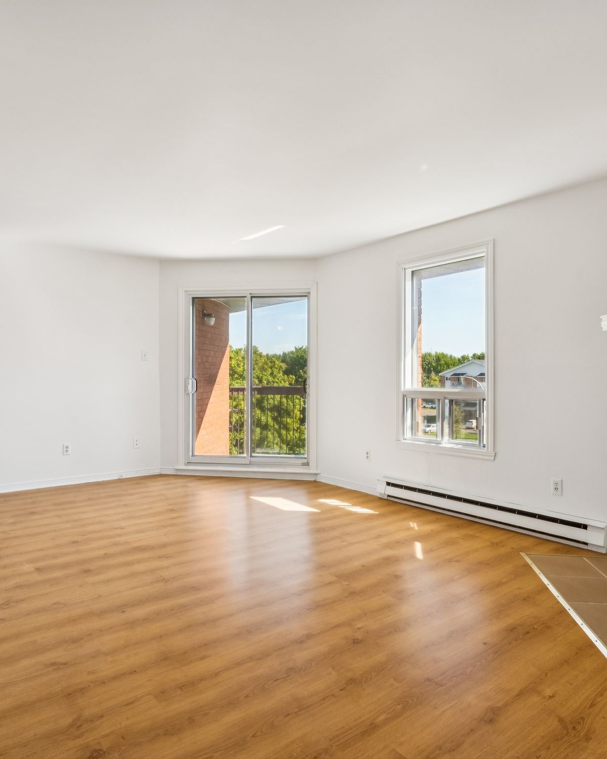 Living room with fireplace at Place Mercier, Candiac