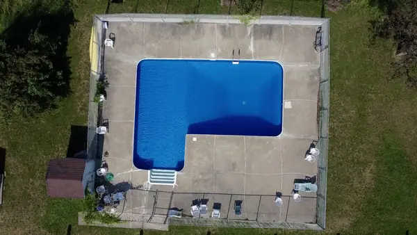 The outdoor pool on the grounds of 43-73 Place Mercier, from the air