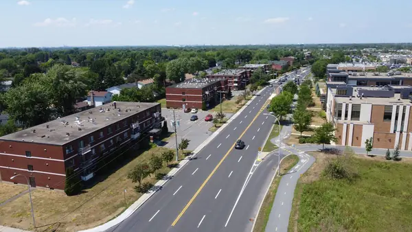 The buildings on boulevard de Montarville seen from above, beside the road and cycle path