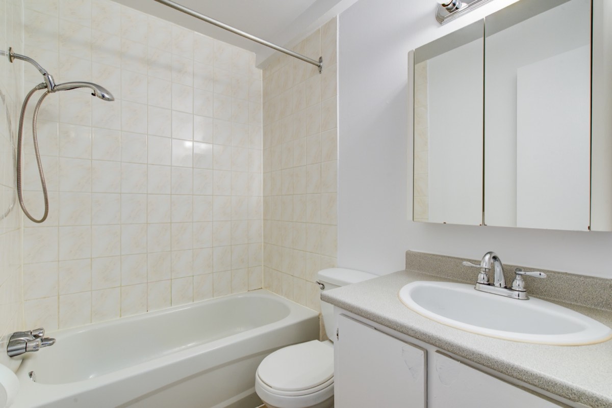 Bathroom with bath, shower and vanity