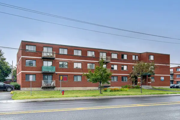 The three-storey brick building seen from boulevard de Montarville