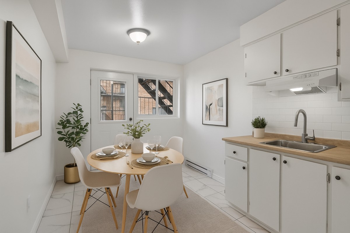 Staged dining area and kitchen in a 4½ at 234 rue Pierrefontaine