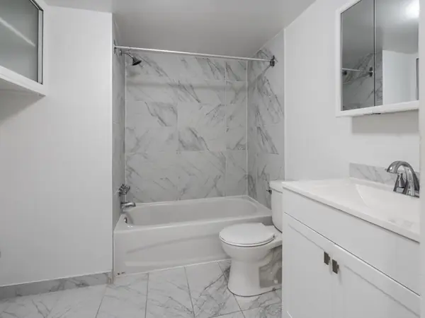 Bathroom with marble-look tiling