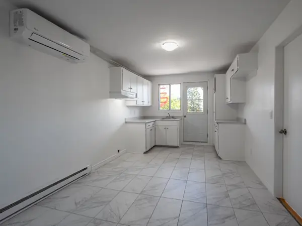 Kitchen with air conditioning unit fitted