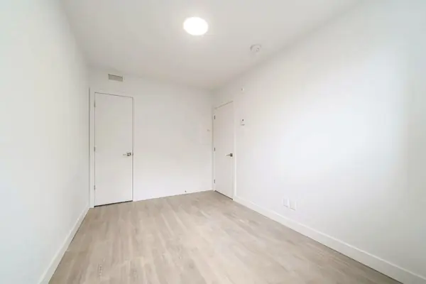 Second bedroom looking toward the doors