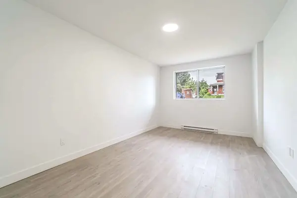 Living room with a window at the far end