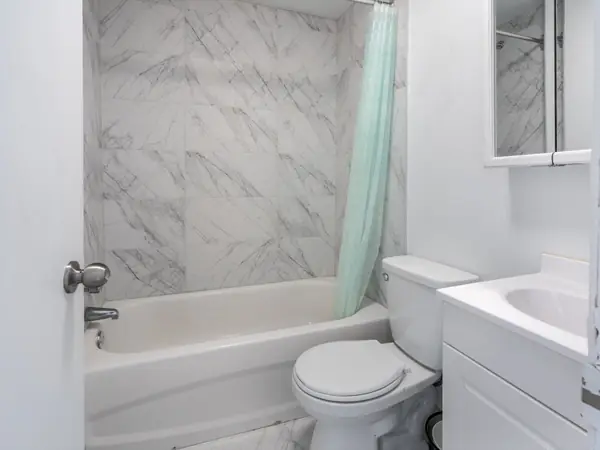 Bathroom with bath and tiled surround