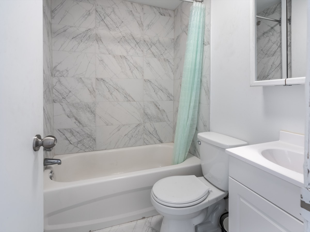 Bathroom with bath and tiled surround
