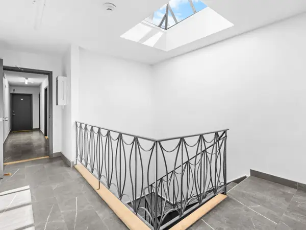 Common stairwell lit by a skylight