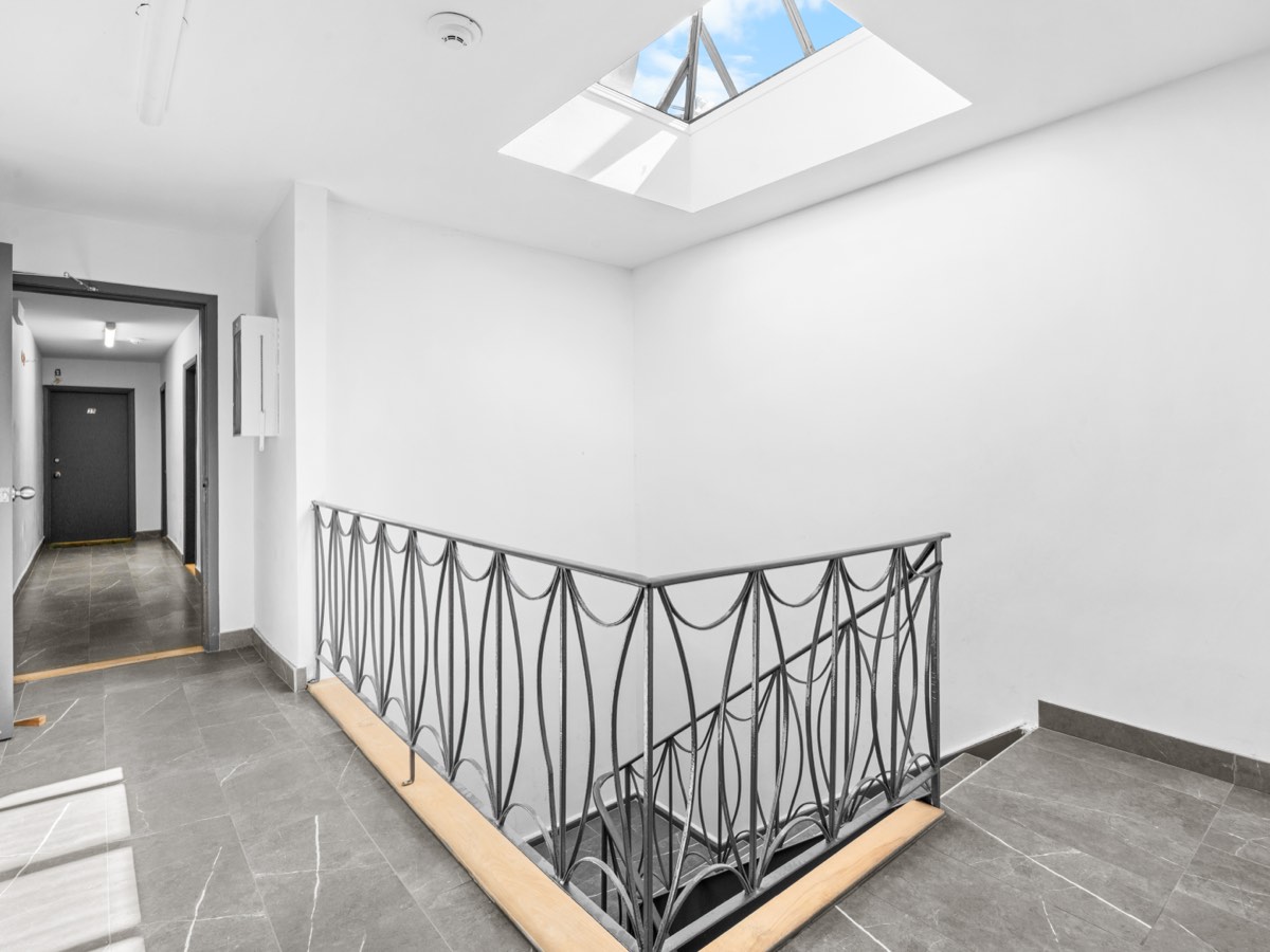 Common stairwell lit by a skylight