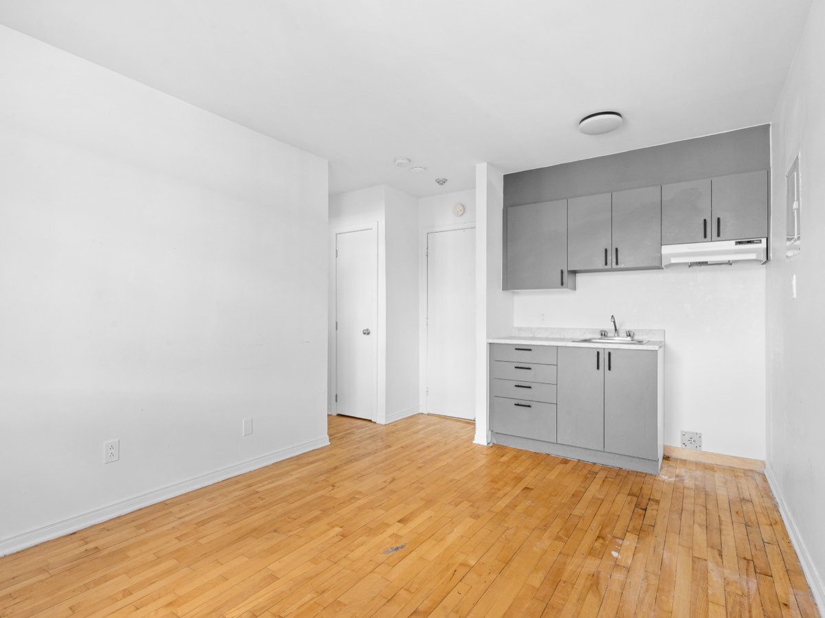 Open kitchen with hardwood floors